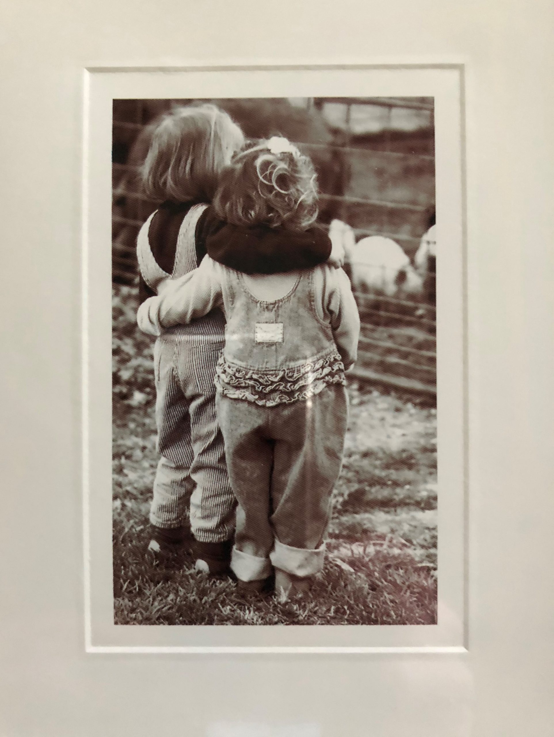 photo of 2 kids hugging