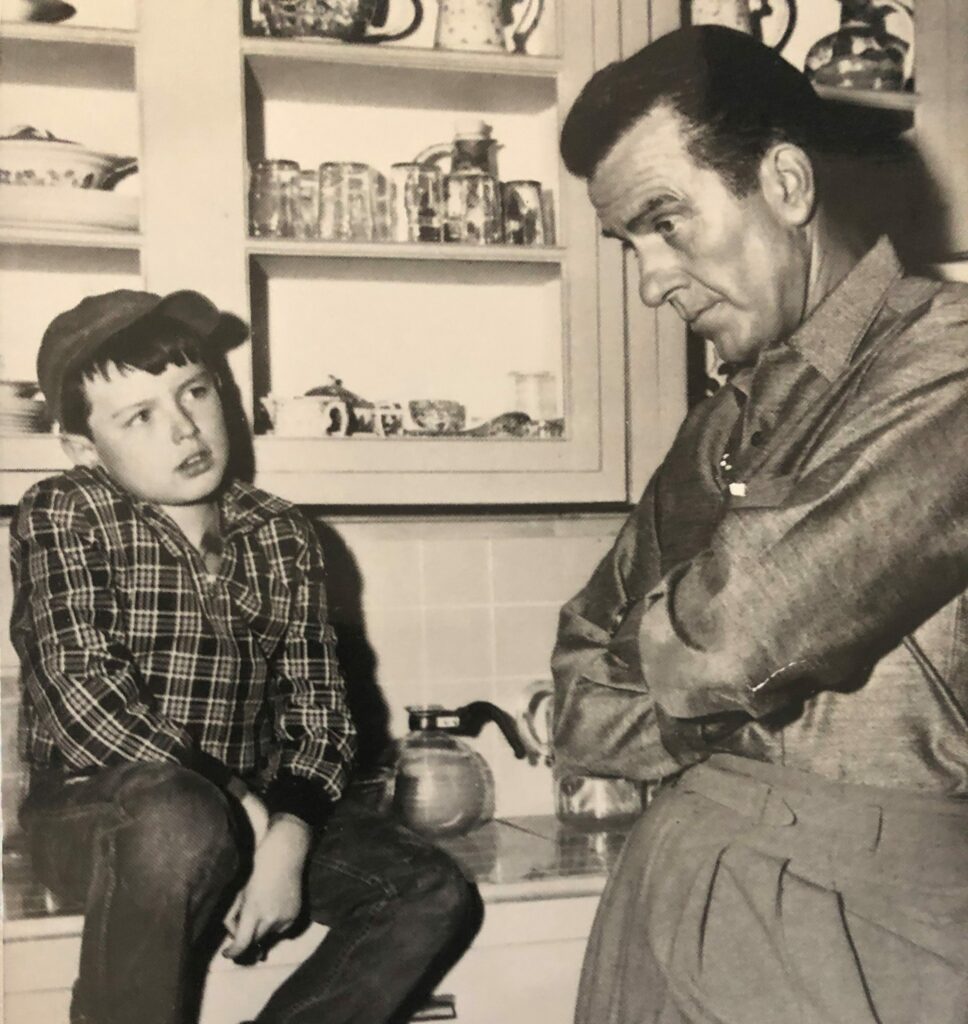 old black and white photo of a man and a kid