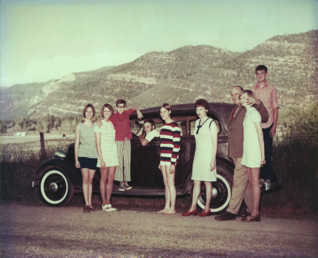 group of people in an old car