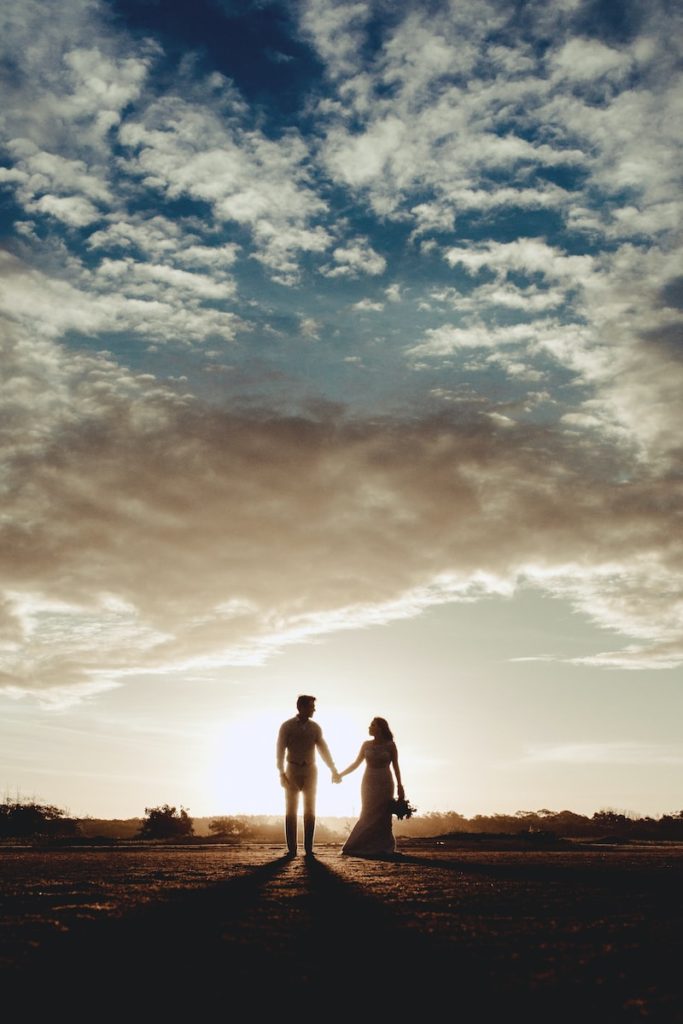 man and woman under clear blue sky depicting their future together